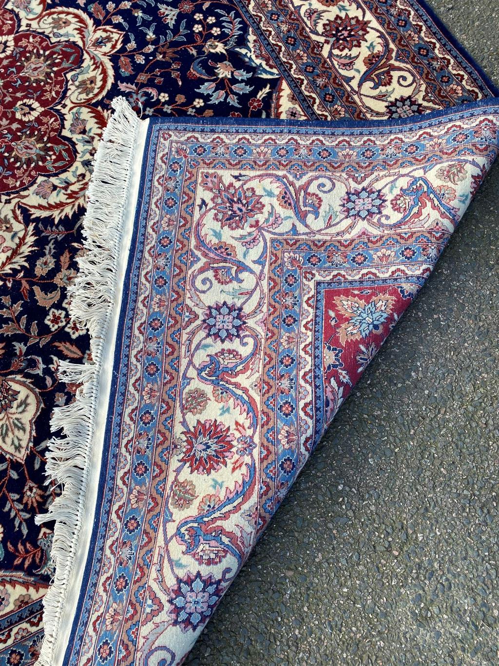 A Duruder blue ground carpet, 306 x 242cm